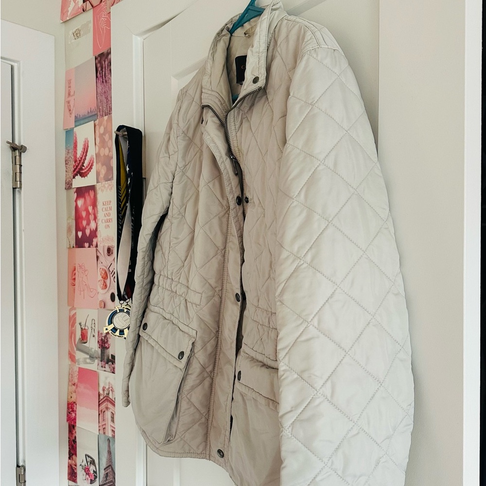 I’m selling a light grey, never worn, coach jacket!